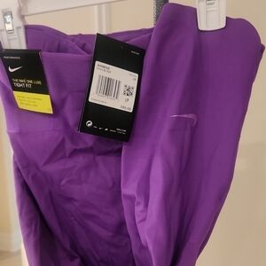 NIKE ONE LUXE $95. Tight Fit Purple Leggings. NEW.  Crop Length. New with Tags!